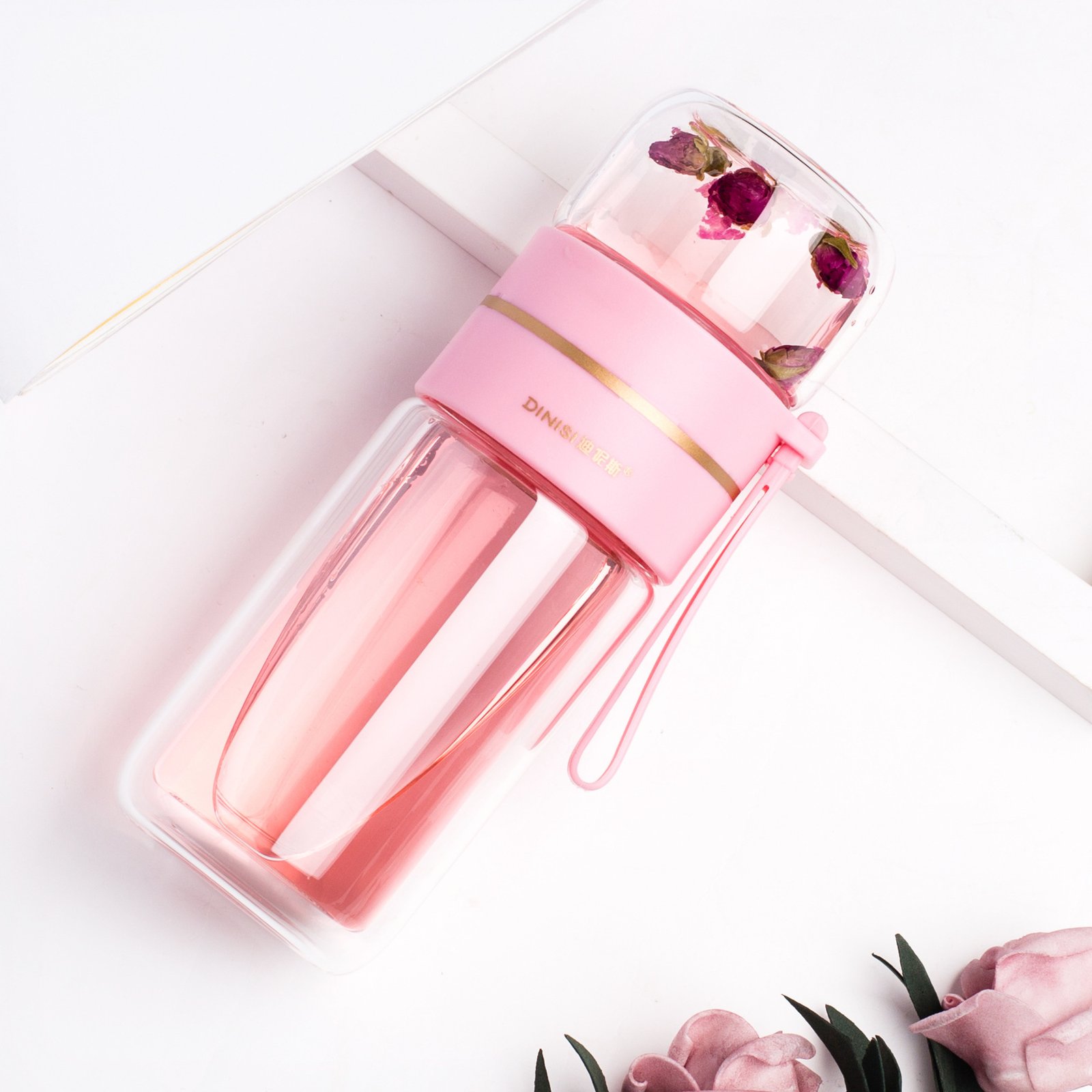 Side view of the Glass Tea Bottle with Infuser, highlighting its double-wall insulation and portable design